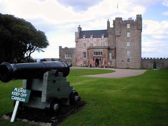 Castle Mey, with cannon in forefront of photograph Castle Mey, with cannon in forefront of photograph