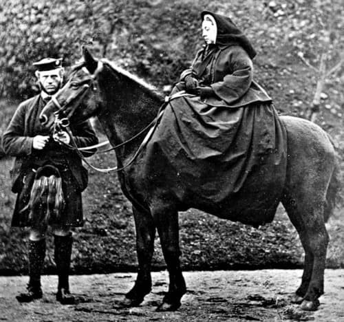 Queen Victoria on Fyvie at Balmoral in 1863 with John Brown standing beside her
