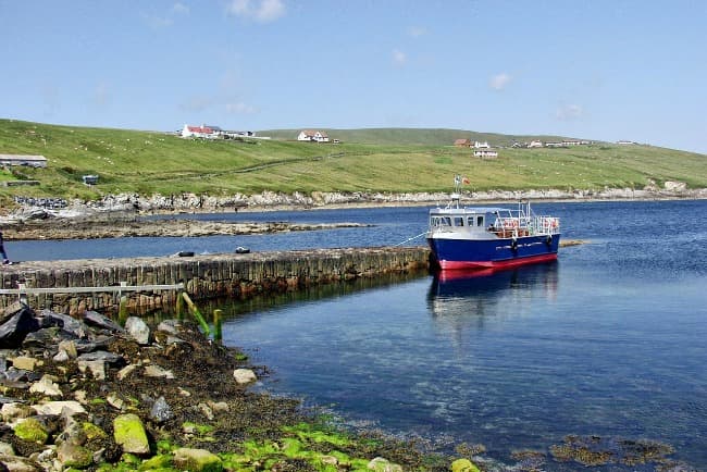 Fishing boats in a harbor on the Sheltand Isles