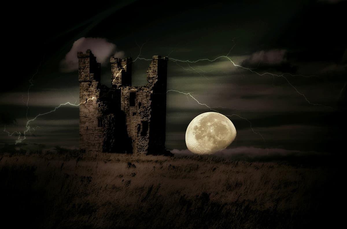 Image of ghostly castle with full moon