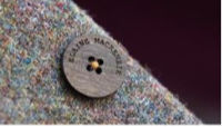 Close up of personalization of wooden waistcoat buttons. Made in Scotland Close up of personalization of wooden waistcoat buttons. Made in Scotland